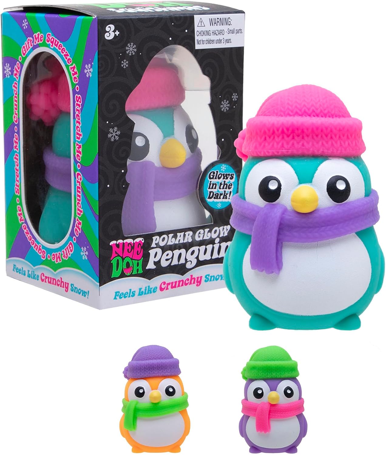 Three colorful penguin squishy toys wearing beanies and scarves next to a Polar Glow Penguin display box.