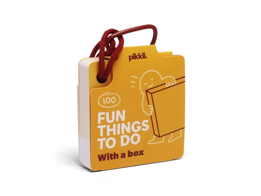 Small yellow activity card deck with a red corded loop, titled 100 Fun Things To Do With a box.