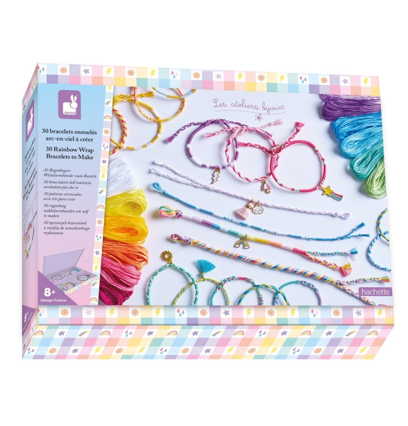 Janod craft kit box displaying colorful embroidery threads and finished rainbow wrap bracelets with decorative charms.