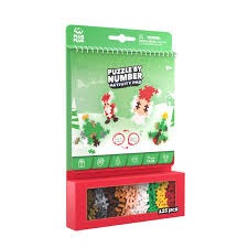 Plus-Plus Christmas Puzzle by Number activity pad with festive designs and 225 colourful building pieces in a red box.