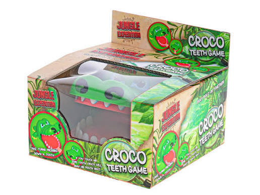Green crocodile toy head with open jaws in jungle-themed cardboard packaging.