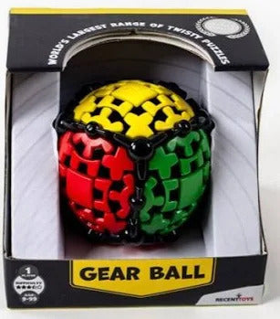 A spherical gear puzzle with red, yellow, and green interlocking parts in its original black and yellow packaging.