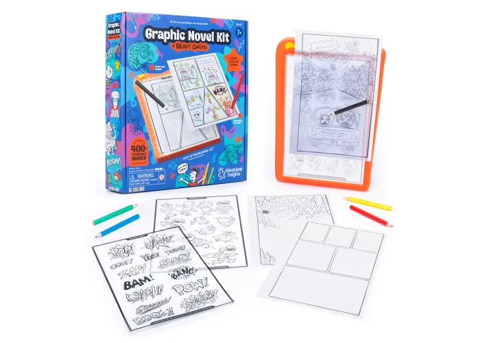 Graphic Novel Kit box beside an orange light-up drawing board with pencils and comic-style tracing sheets.