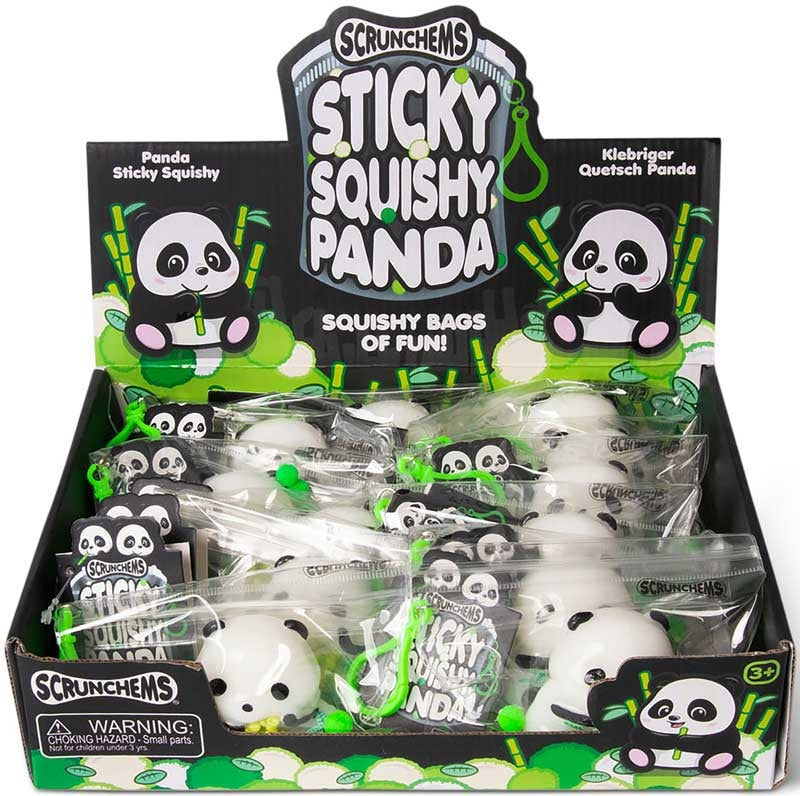 Retail display box containing individually bagged white and black panda squishy toys with green clips.