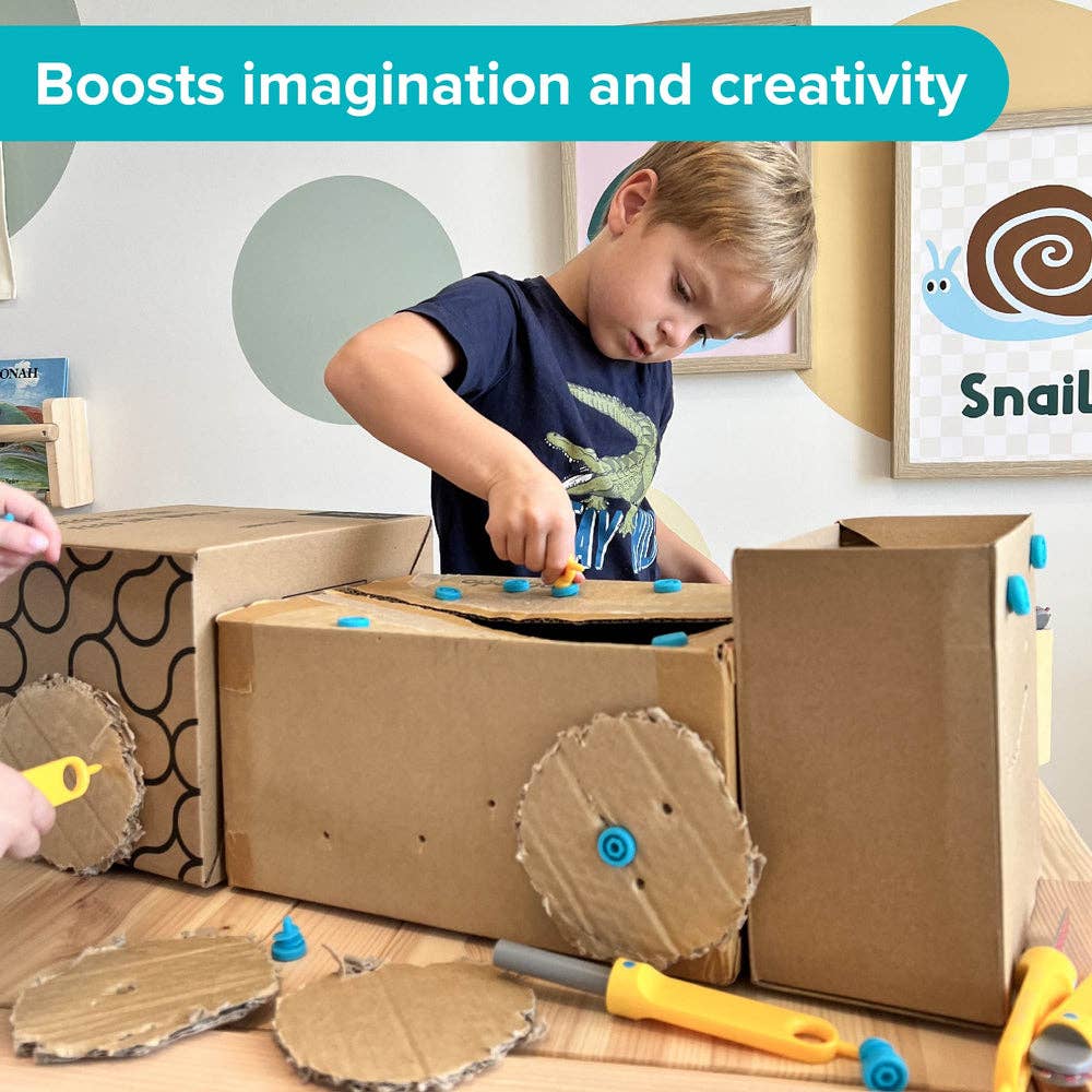 Young boy builds a cardboard vehicle with blue screws and yellow tools. Text: Boosts imagination and creativity.