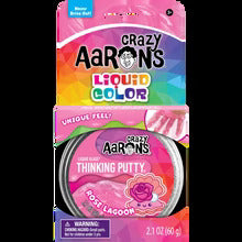 Pink packaging for Crazy Aaron's Rose Lagoon Thinking Putty, featuring a tin with a seashell and rose graphic.