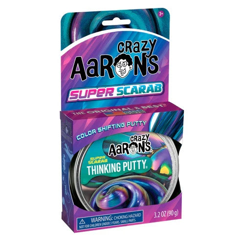 Crazy Aaron's Super Scarab Thinking Putty in purple packaging showing a tin of iridescent blue and purple putty.