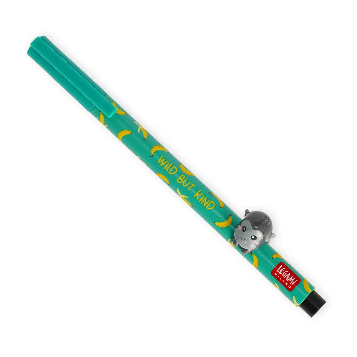 Green Legami pen with yellow banana patterns, a small grey monkey figurine, and text reading WILD BUT KIND.