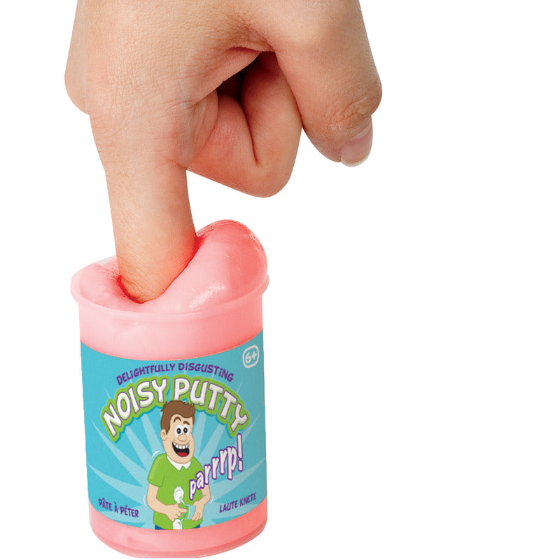 Finger pressing into a small tub of pink putty with a blue label featuring a cartoon boy and Noisy Putty text.