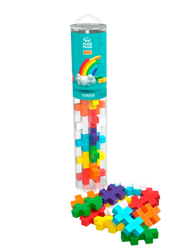 Colorful plus-shaped blocks in a clear tube and scattered below. Teal label features a rainbow and cloud illustration.