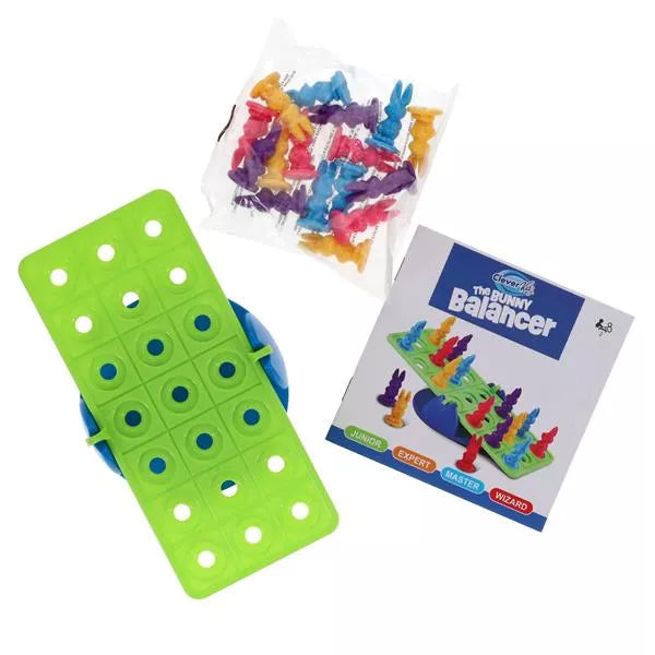 Green grid board on a blue base, bag of colorful bunny pegs, and an instruction manual for a balancing game.