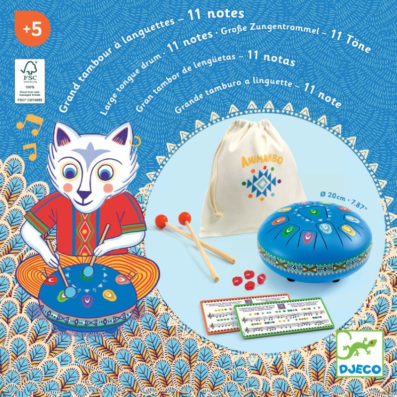 A blue 11-note tongue drum with two wooden mallets, a white drawstring bag, and music cards on a patterned background.