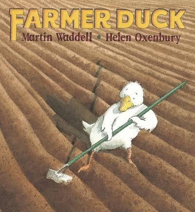 Book cover of Farmer Duck showing a white duck holding a garden hoe in a ploughed brown field.