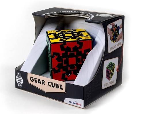 Black gear-based cube puzzle with yellow and red gears in a branded display box.
