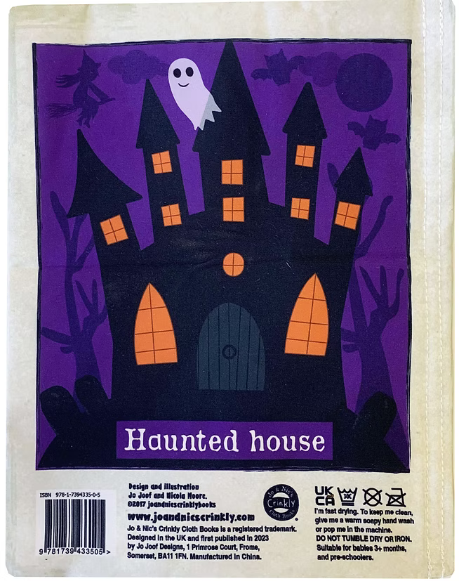 Back of a children's paper toy package featuring a purple haunted house illustration with a ghost, black silhouettes, and orange window lights. The package includes a barcode, product description, care instructions, and branding for Jee Jee Designs.