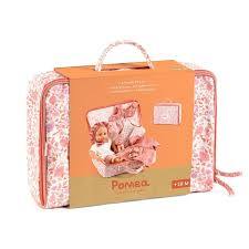 A pink floral patterned soft suitcase for dolls, featuring an orange cardboard sleeve and a carrying handle.