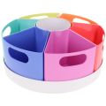 Six rainbow-colored wedge bins with handles arranged on a rotating white circular base.