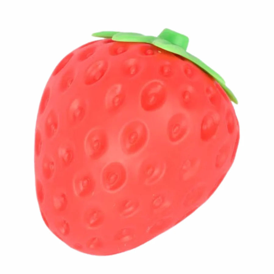 A red strawberry-shaped squishy toy with green leaves and a textured surface featuring small indentations.