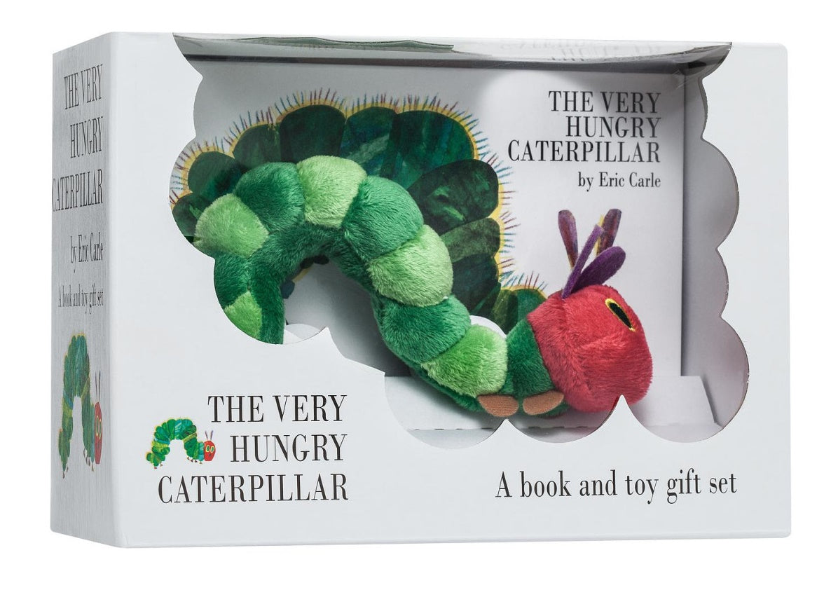 A white gift box containing a green and red plush caterpillar toy and a board book by Eric Carle.