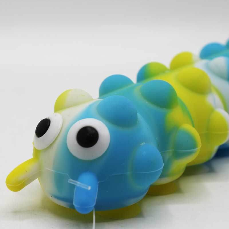 Blue and yellow marbled silicone caterpillar toy with large googly eyes and many raised sensory pop bubbles.